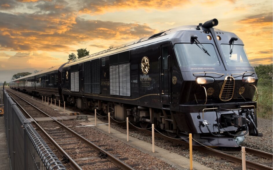 The Emblem Contrasts Gracefully with the Royal Wine Red Exterior. The 7-car Passenger Train Reflects the Elegance of the Journey