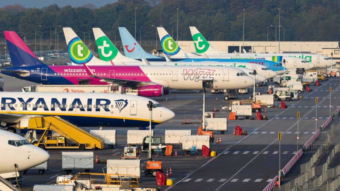 Various low-budget airline aircraft parked at the terminal of Eindhoven-Airport.