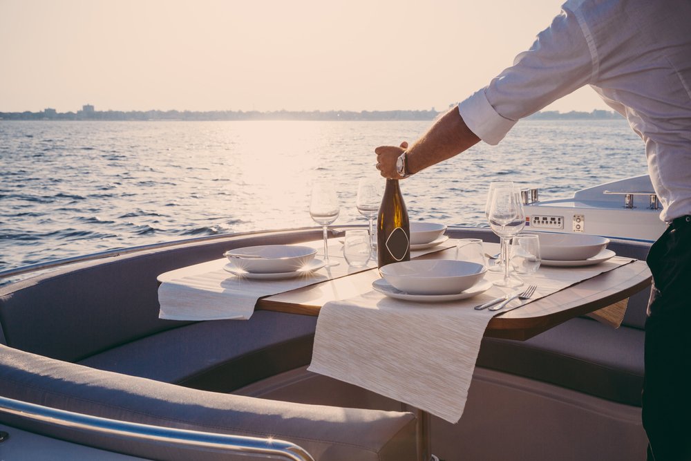 Luxury Travel: Romantic Lunch On Motor Yacht At Sunset