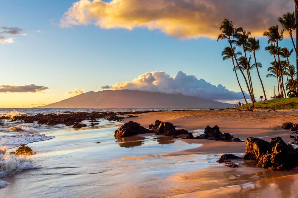 The Sunset Creates A Warm Glow On A Beach