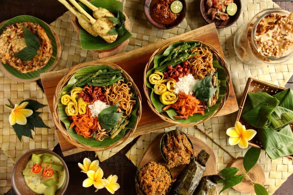 Nasi Campur Bali. Popular Balinese meal of rice with variety side dishes, which are served together with the rice and more as optional extras.