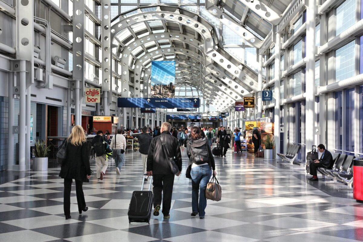 Travelers walk to gates at Chicago O’Hare International Airport in USA. It was the 5th busiest airport in the world with over 67 million passengers