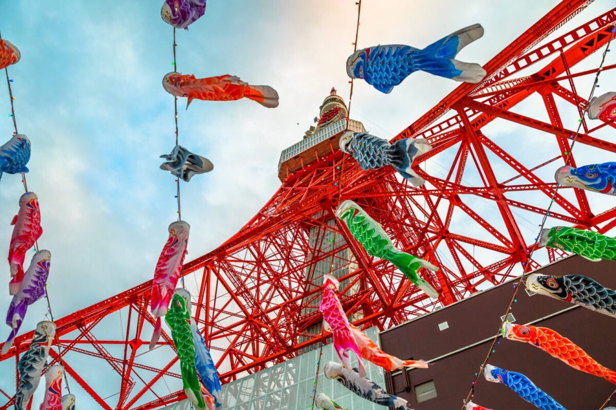 View of colorful Koinobori at Tokyo Tower. Koinobori are carp-shaped wind socks traditionally flown in Japan to celebrate Children’s Day during the Golden Week.