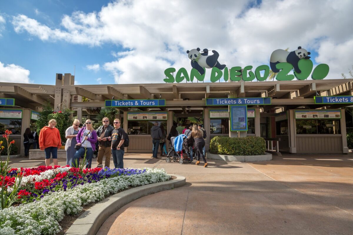 Tourists and locals just in front the main entrance of San Diego Zoo in California, USA.