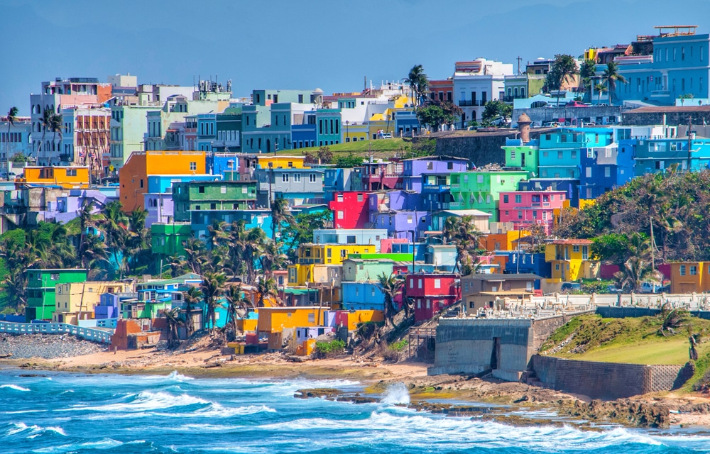 Colorful houses line the hillside over looking the beach in San Juan, Puerto Rico